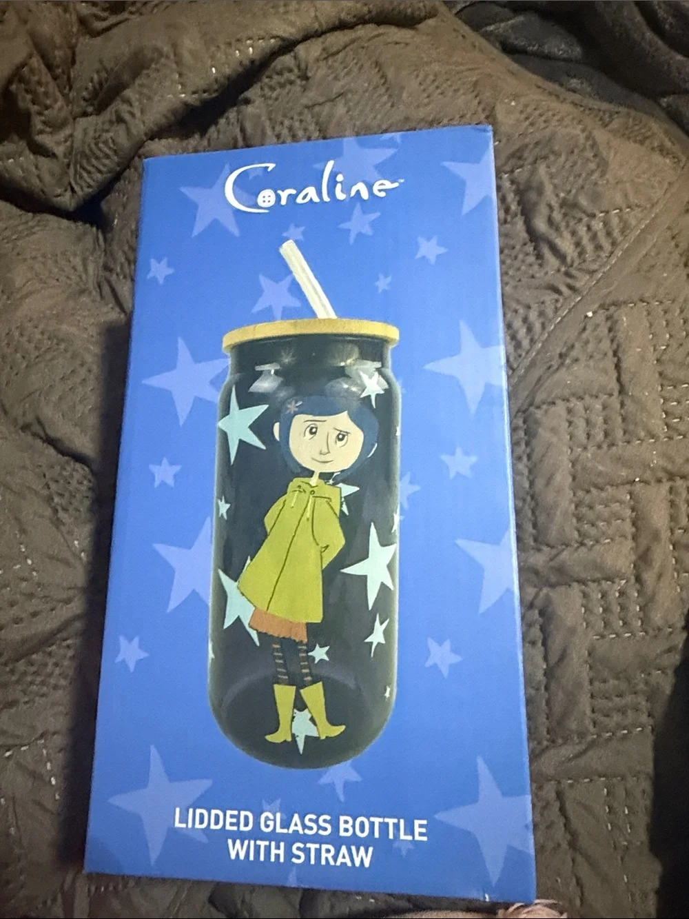 Purple Glass Bottle with Character Print and Yellow Lid
